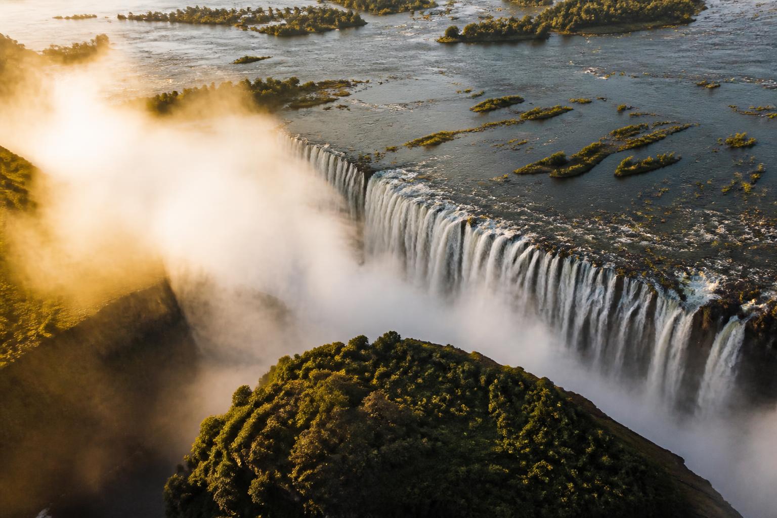 Victoria Falls illuminated by golden-hour light